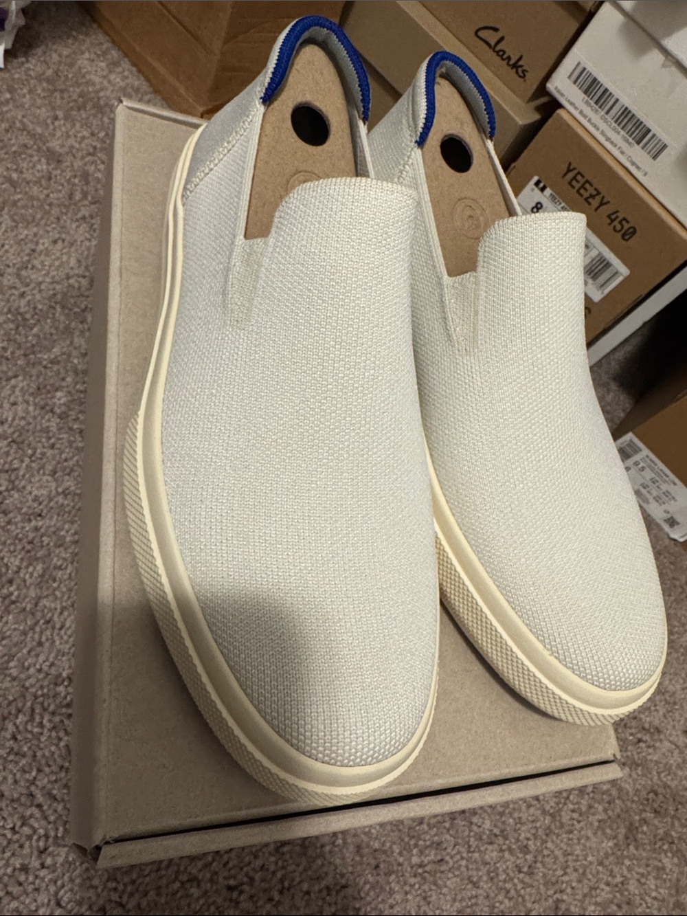 Rothy's city Slip-On Sneakers in Off-White with Blue Heel Tab